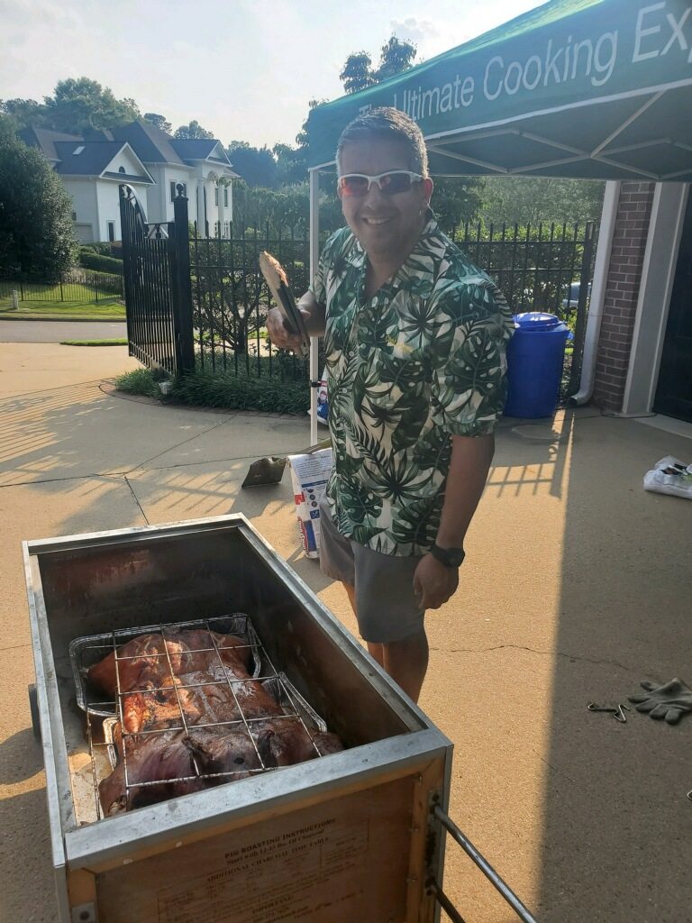 Dan standing beside the opened roasting box in the driveway